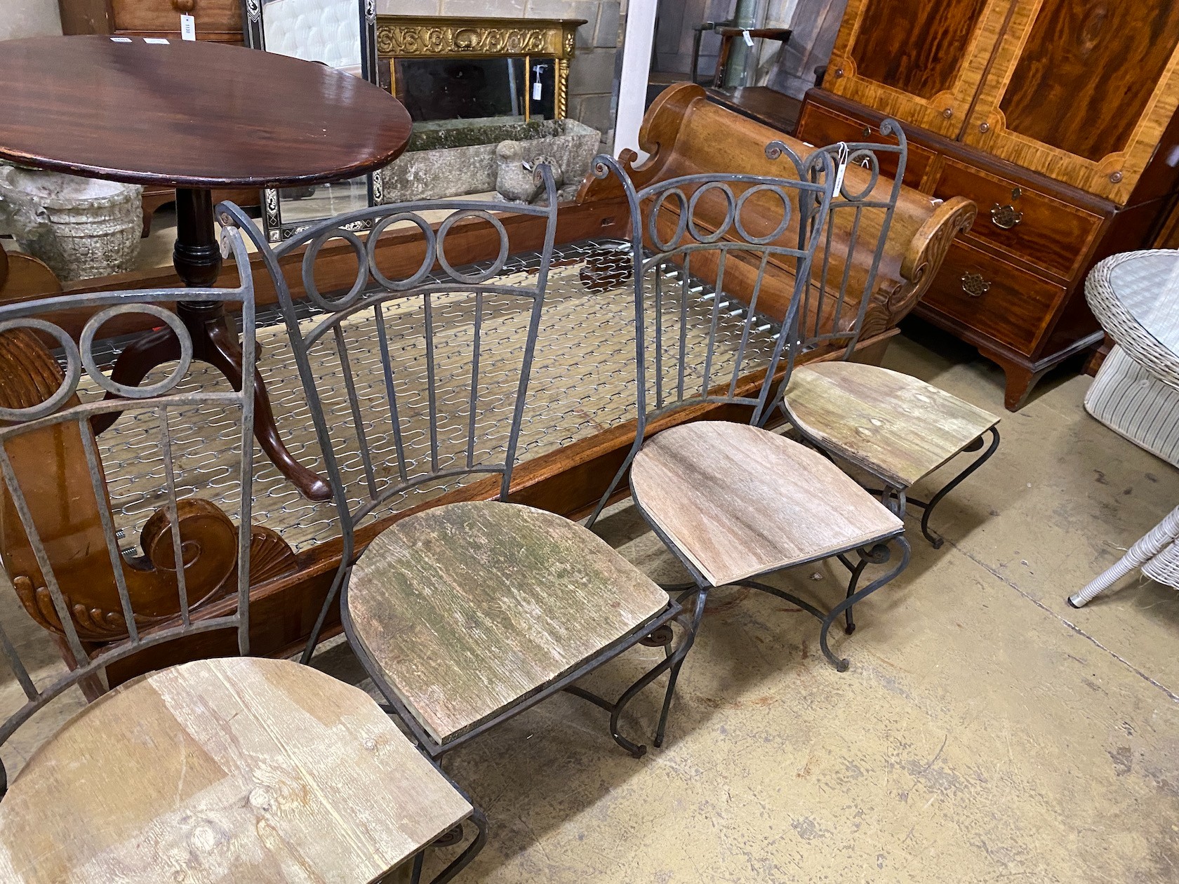 Five wrought iron wood seat garden chairs